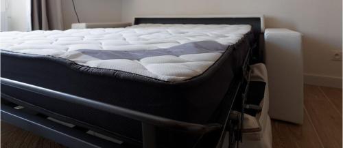 a mattress on a bed frame in a room at Le King & Suites étoilées in Gréoux-les-Bains