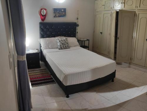 Ένα ή περισσότερα κρεβάτια σε δωμάτιο στο Casa familiar