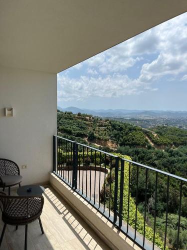 a room with a balcony with a view at Apartment with view in Tirana in Shkozë