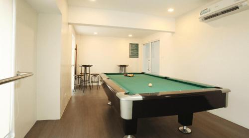 a billiard room with a pool table in it at A Marina Spatial 2BR , 2Showers, 1Balcony, 1 Storage Room in Dumaguete