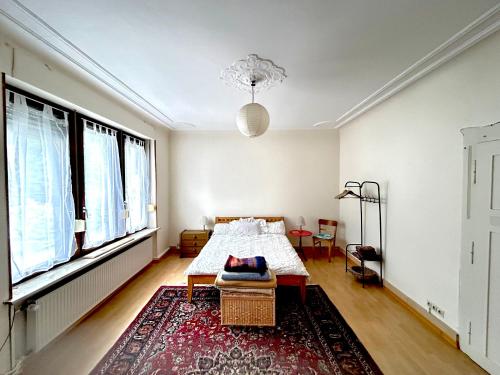 a bedroom with a bed and a large window at Forest Charm and Gems in Idar-Oberstein