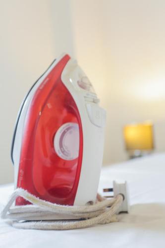 a red and white appliance sitting on top of a counter at Accra Luxury Apartments at Clifton Place in East Legon
