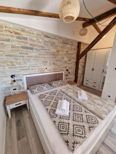 Postel nebo postele na pokoji v ubytování Apartments and Rooms Lucia&Veronica