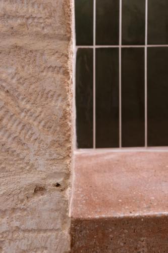 a window on the side of a building at Qualia Slowlife Suites in Chania Town