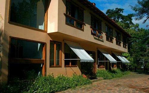 a building with a bunch of windows on it at Terracota Hotel in Itaipava