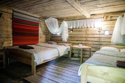 Postel nebo postele na pokoji v ubytování Muhu Tõnise Talu