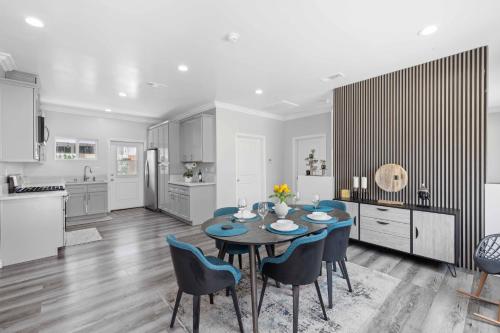 a kitchen and dining room with a table and chairs at Stylist Home In Convenient Location! in Temple City