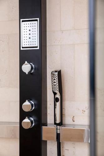 a black door with a phone on the wall at Terrazza Nostromo Francesco in Trani