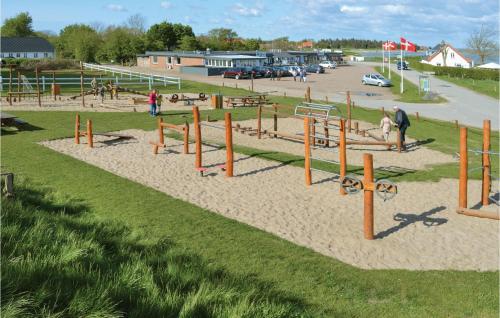 a playground with play equipment in a park at Holiday Home Skovstjernevej Lemvig Ii in Lemvig