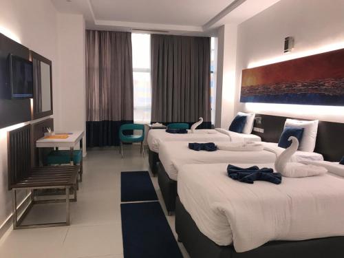 Postel nebo postele na pokoji v ubytování Gloria Aqua Park Hotel