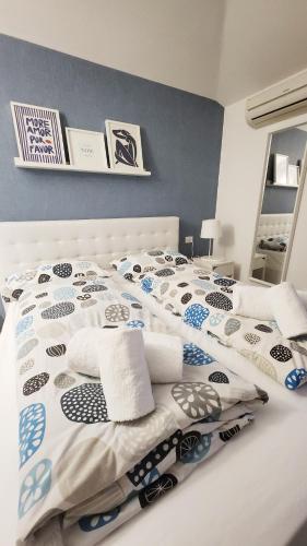 a bedroom with a bed with two pillows on it at Casa Barcelli Sport & Family Apartments in Nago-Torbole