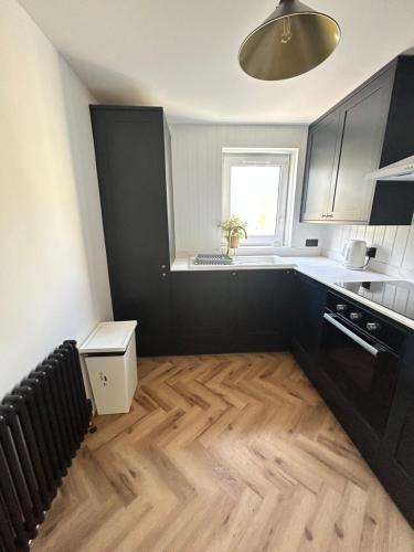 Kuchyň nebo kuchyňský kout v ubytování Harbour Apartment