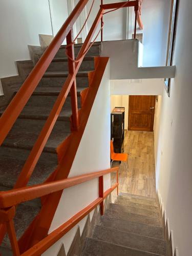 a staircase in a house with wooden railings at Il Glicine in Parma