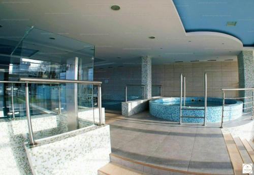 a building with a hot tub in the middle of it at Club218 Vízparti Wellness Apartman in Siófok