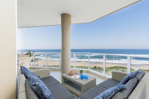 a living room with a view of the ocean at Lucien Sands 401 in Margate