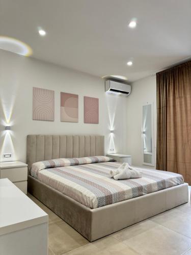 Кровать или кровати в номере La maison guest house