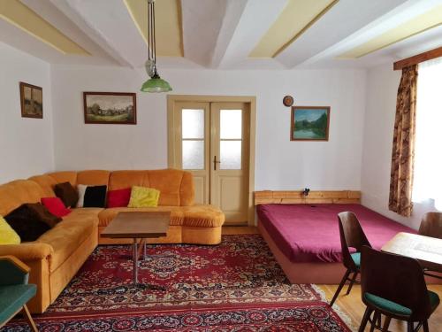 a living room with a couch and a table at Chalupa Vokov dovolená na Vysočině ubytování Pelhřimov in Vokov