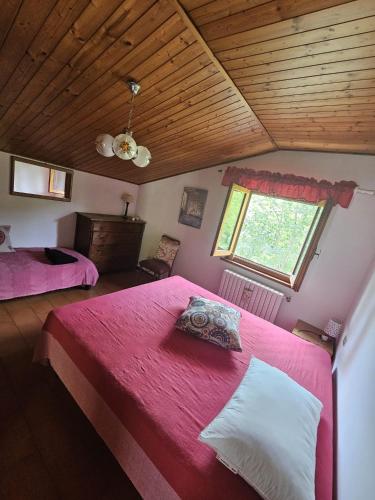 Ένα ή περισσότερα κρεβάτια σε δωμάτιο στο La casa di Marta