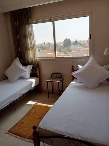 Postel nebo postele na pokoji v ubytování Le Fairouz Appartement Haut Standing centre ville Piscine