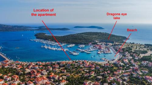 a view of a harbor with boats in the water at Seafront apartments Marija in Rogoznica