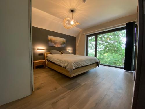 Postel nebo postele na pokoji v ubytování Gîte de la Tour