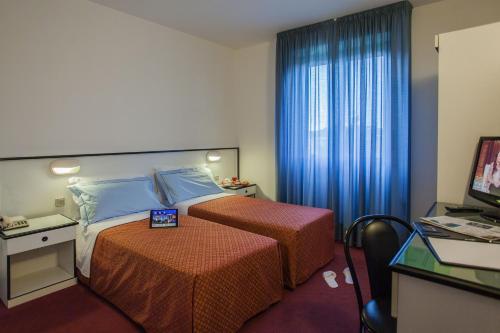Katil atau katil-katil dalam bilik di Hotel Quadrifoglio