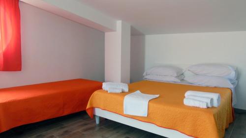 A bed or beds in a room at Casa Vacanza Miramare