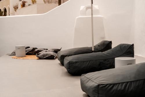 a room with three bean bags on the floor at Villa Karterados Suites in Karterados