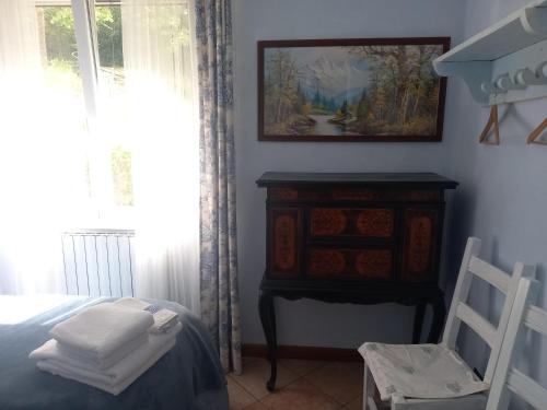 Una cama o camas en una habitación de B&B Le Camelie del Bosco