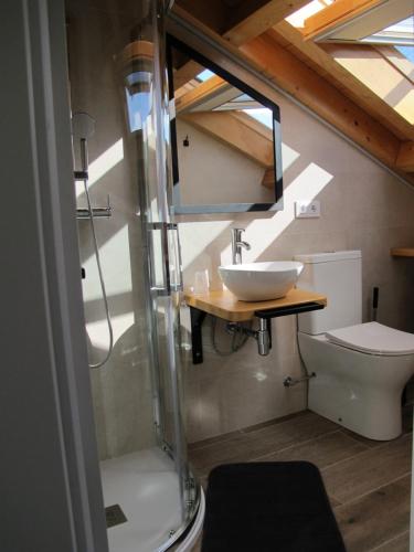 a bathroom with a sink and a toilet at Casa Vacacional La Pedrera in Baró