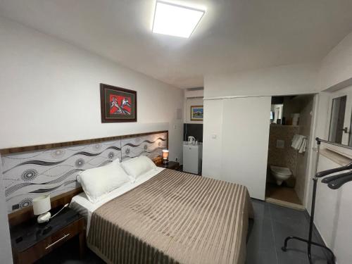 Ένα ή περισσότερα κρεβάτια σε δωμάτιο στο Rooms Tirreno