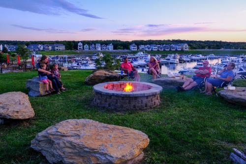 a group of people sitting around a fire pit at Out of Office in Ottawa