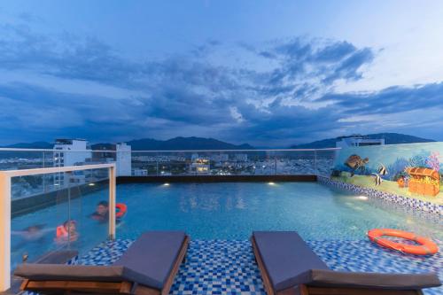 a swimming pool on the roof of a building at Le's Cham Hotel in Nha Trang