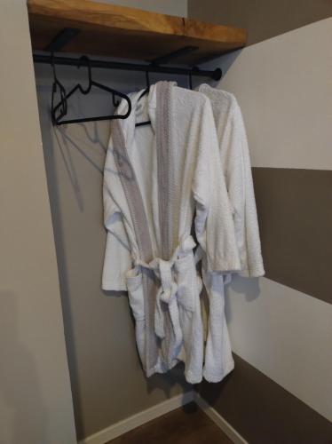 a bunch of towels hanging on a rack in a room at "Da Manu Loft" Centro Storico in Fano