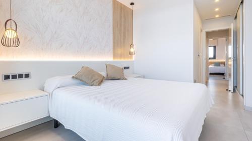 Ένα ή περισσότερα κρεβάτια σε δωμάτιο στο Apartamento Familiar - Sunset Waves -Grupo AMI