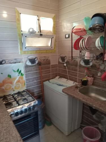 A kitchen or kitchenette at Free Wi-Fi شقة فندقية فى الاسكندرية New apartment sea view Alexandria