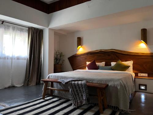 Ένα ή περισσότερα κρεβάτια σε δωμάτιο στο Kengbari Retreat