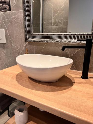 a bowl sink on a wooden counter in a bathroom at Modern Stay I Cosy & Central Apartments in Koblenz