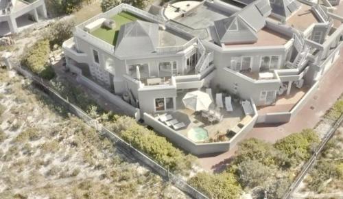a model of a white house with at Pingu Beachhouse with Jacuzzi Hout Bay Cape Town in Cape Town