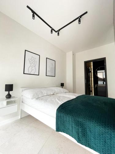Postel nebo postele na pokoji v ubytování Apartament z Tarasem na Dachu