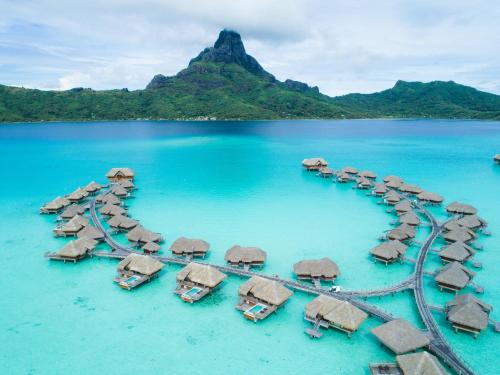 an aerial view of a resort in the water at InterContinental Bora Bora & Thalasso Spa by IHG in Bora Bora