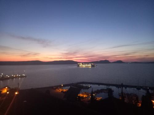 a boat in the water at sunset at Bay blue in Pylos