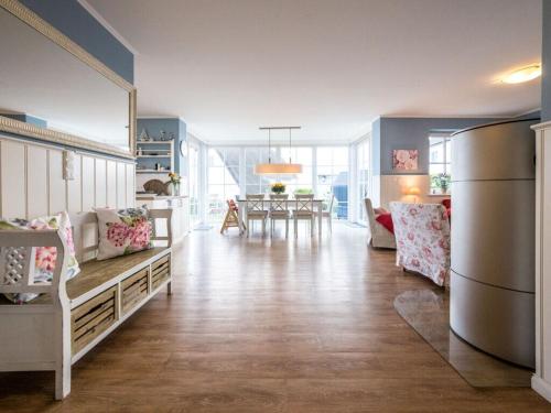 a large living room with a kitchen and a dining room at Blue Wonder Comfortable holiday residence in Zinnowitz