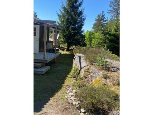 a view of a yard with a house at Pure relaxation in Sweden in Molkom