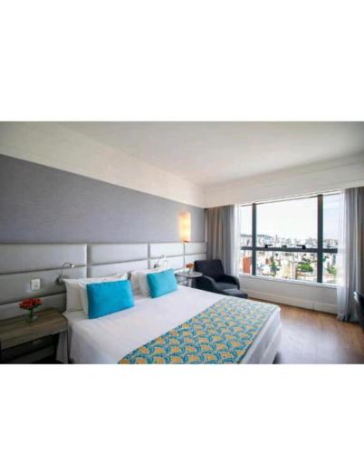 Ένα ή περισσότερα κρεβάτια σε δωμάτιο στο Flat BH Savassi