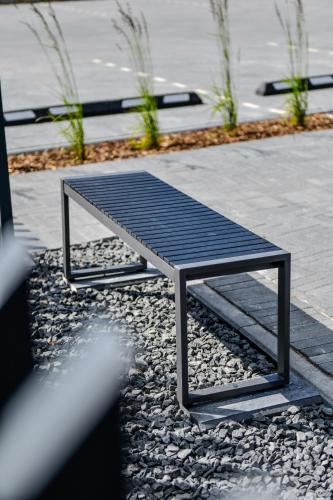 a bench sitting on top of a pile of gravel at Vila Vida in Palanga