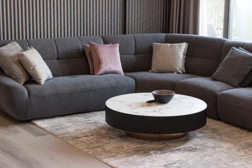 a living room with a couch and a coffee table at 2Bedroom Apartment - Uptown Al Zahia, Sharjah - Stone House in Sharjah