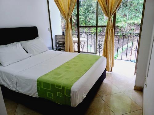 Katil atau katil-katil dalam bilik di Hotel Campestre La Gaitana