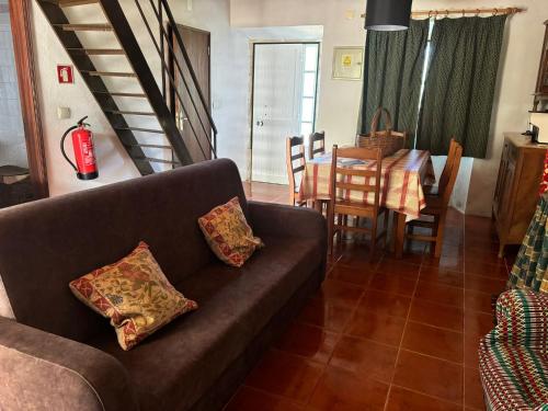 a living room with a couch and a table at Casa dos Terranhos in Tomar