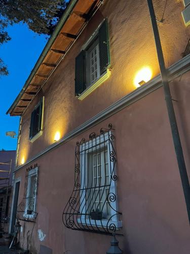 a building with a gate and windows at night at Allulivus in Montenero